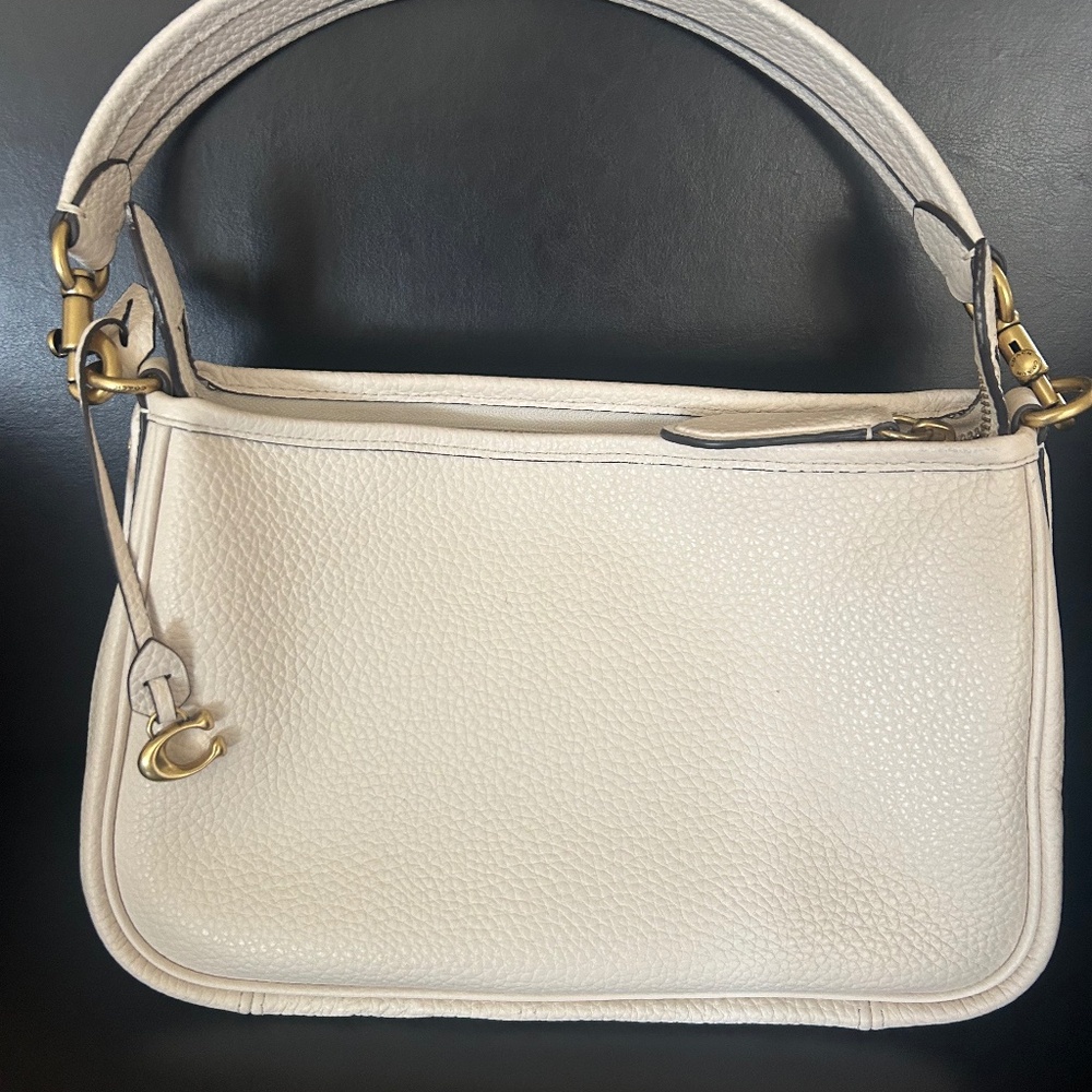 Coach leather shoulder bag in bone.